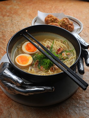 Homemade ramen noodles with chicken karaage and grilled chicken , agitsuke tamago and chicken broth