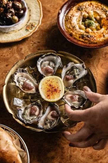 Fresh Oysters Dubai served on ice with lemon and seafood accompaniments