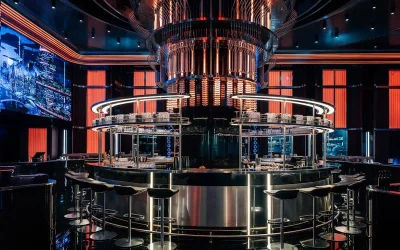 Futuristic interior of Millionaire Lounge Dubai featuring a circular luxury bar, high-tech lighting, and immersive modern design ambiance.