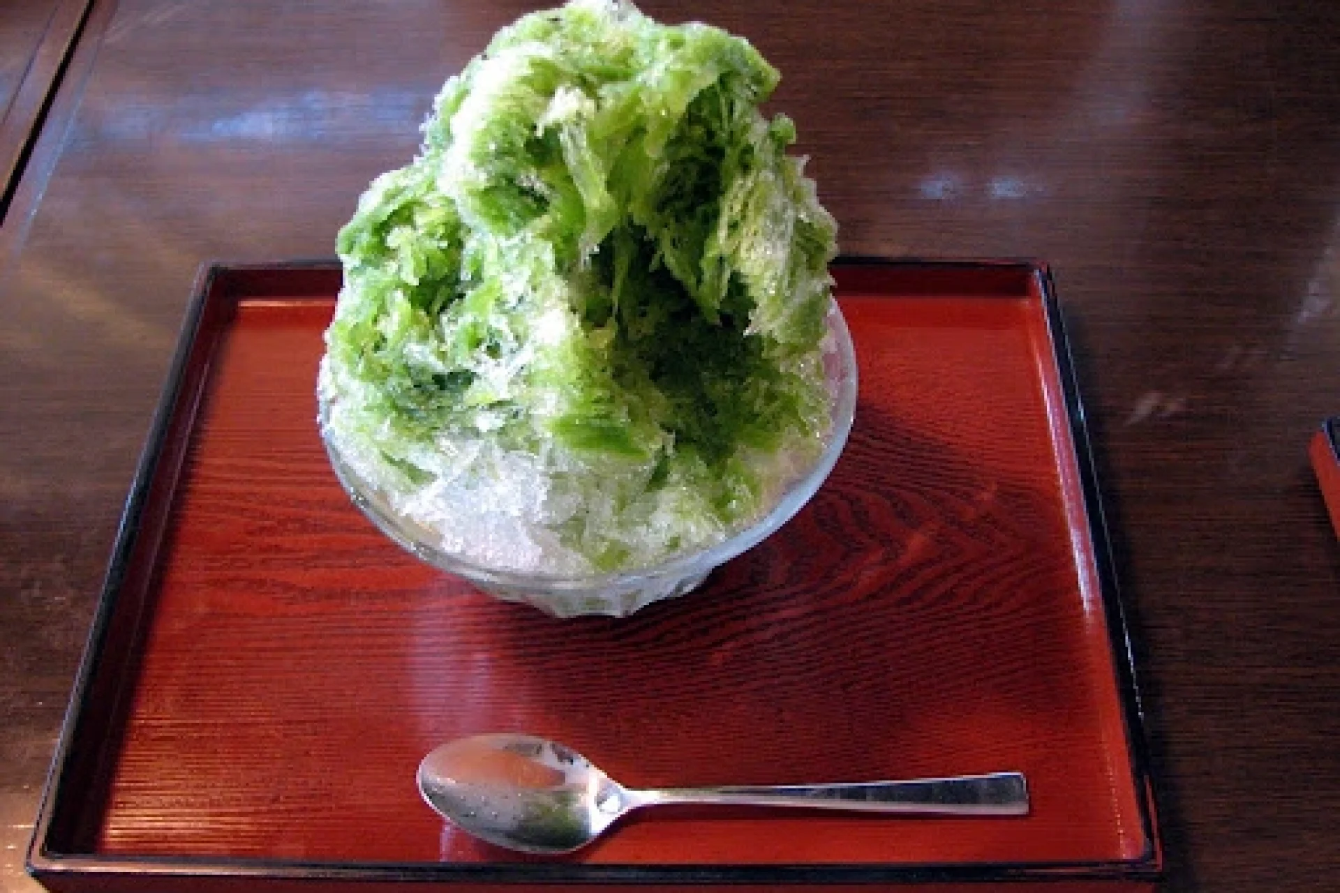 Matcha Kakigori Japanese shaved ice dessert served in a traditional Japanese tray